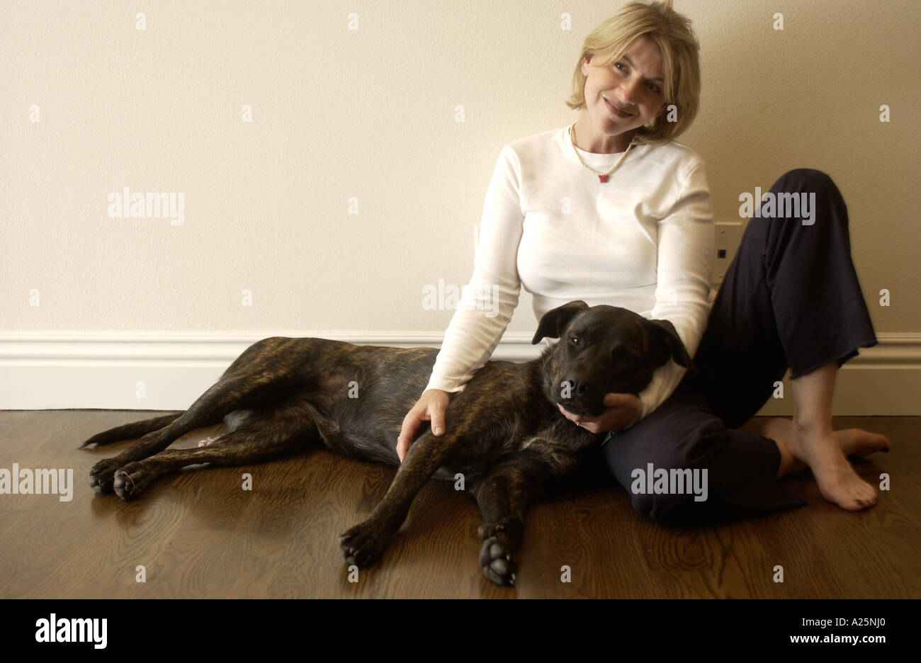 A portrait of a woman with her dog Stock Photo - Alamy