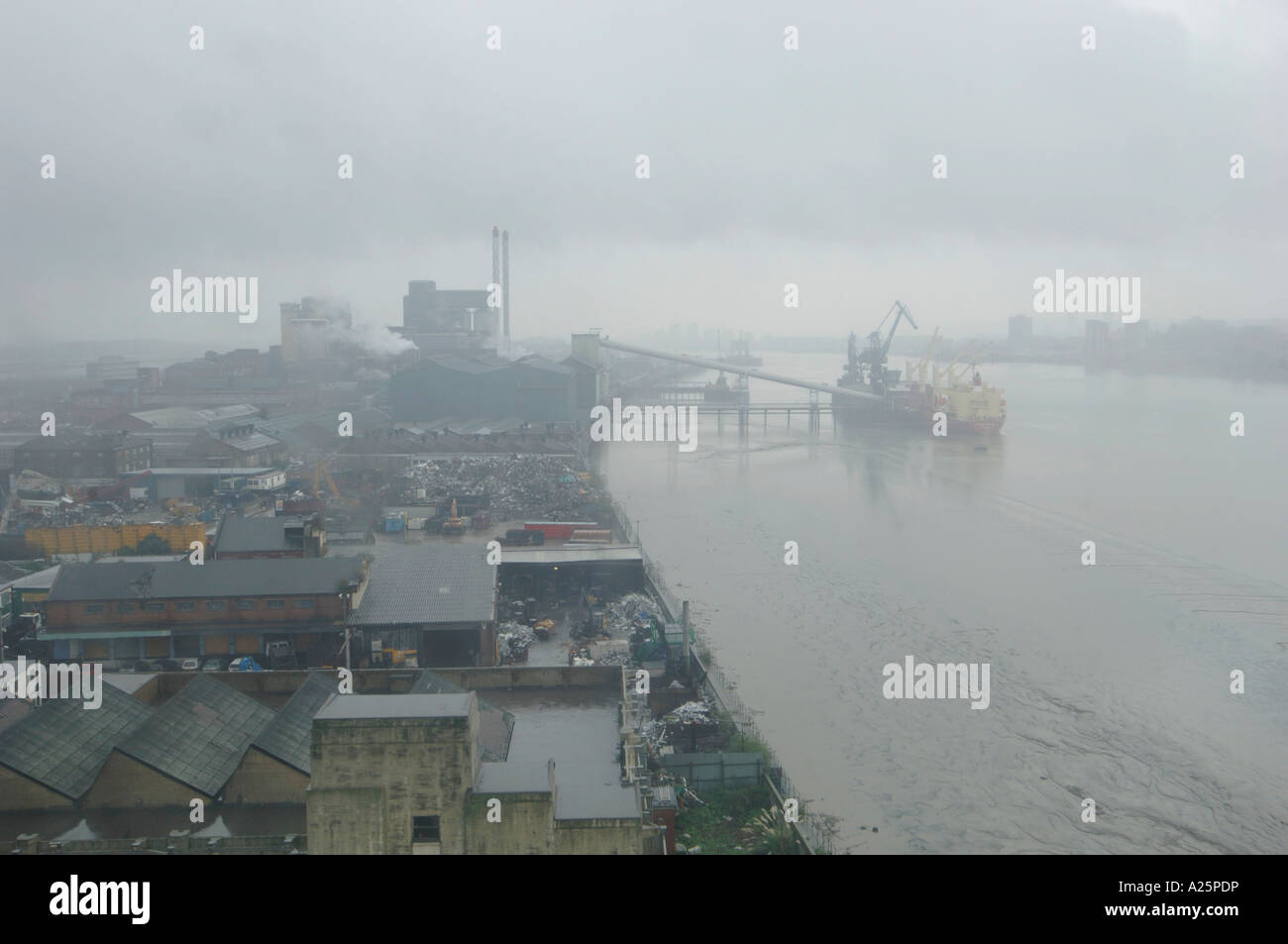 view of foggy murky misty river thames from tradewinds apartment london