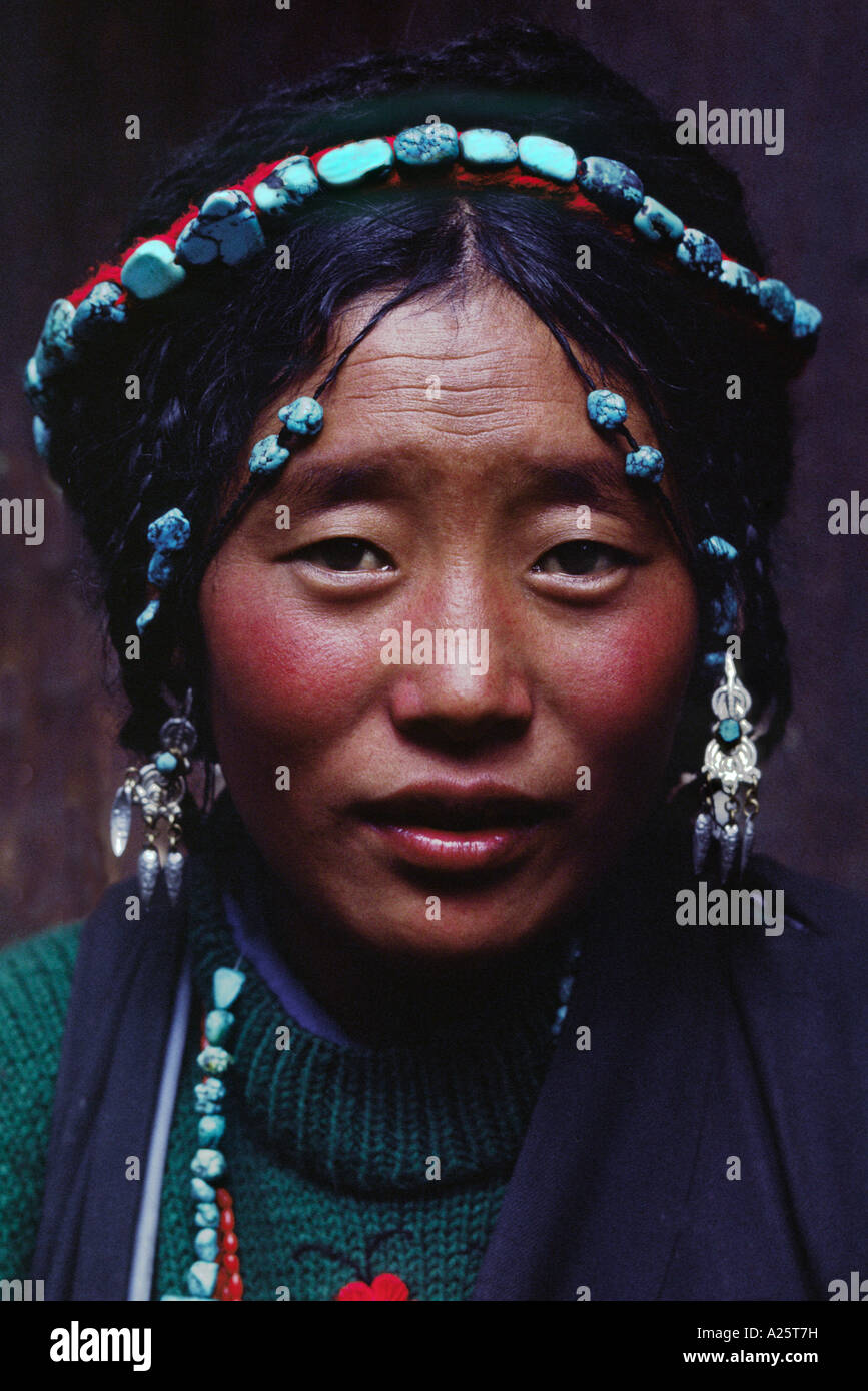Tibetan beauty with elaborate tourquoise headdress Barkhor Lhasa Stock Photo