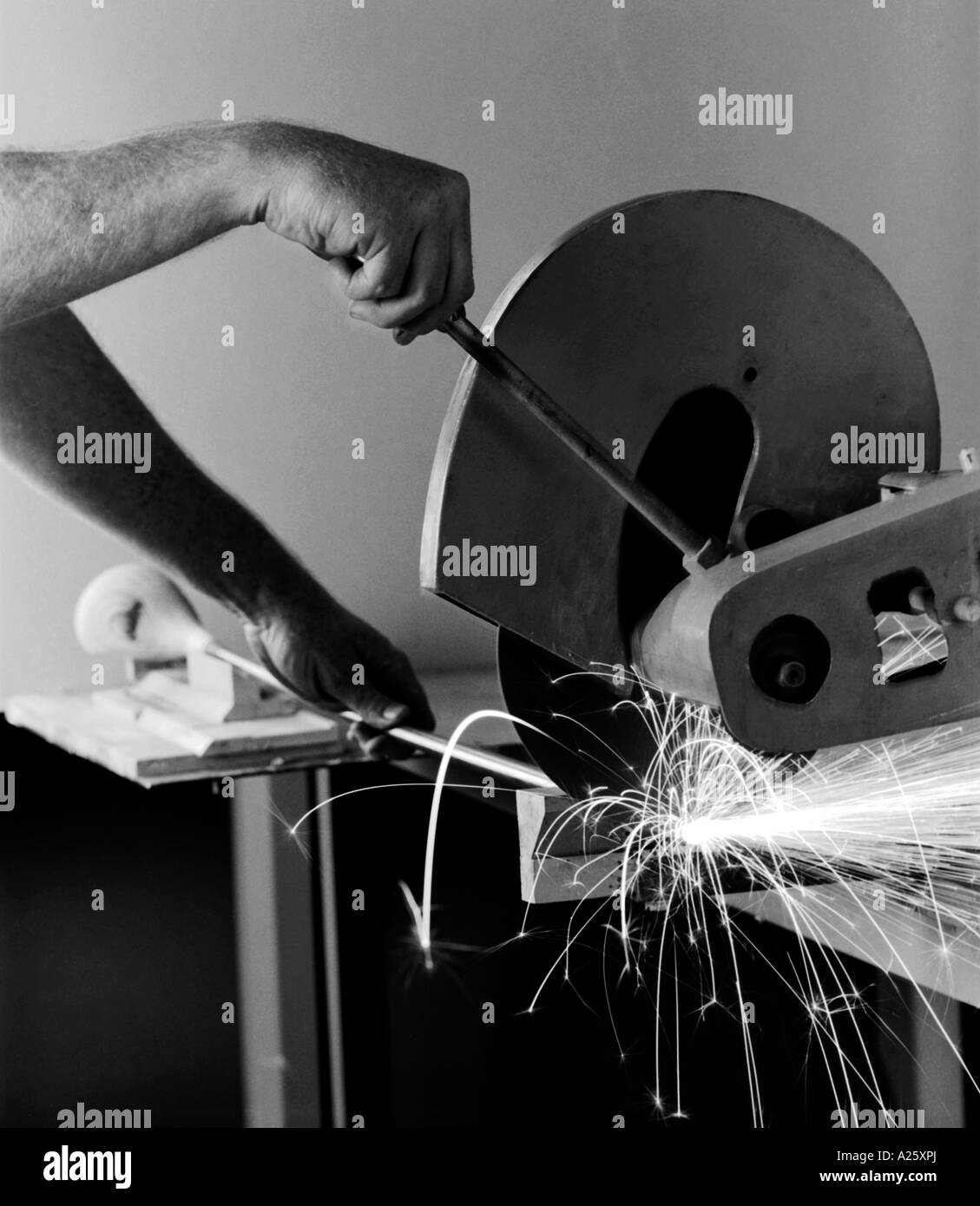 Cutting the shaft of a WOOD CLUB at a GOLF CLUB FACTORY which makes