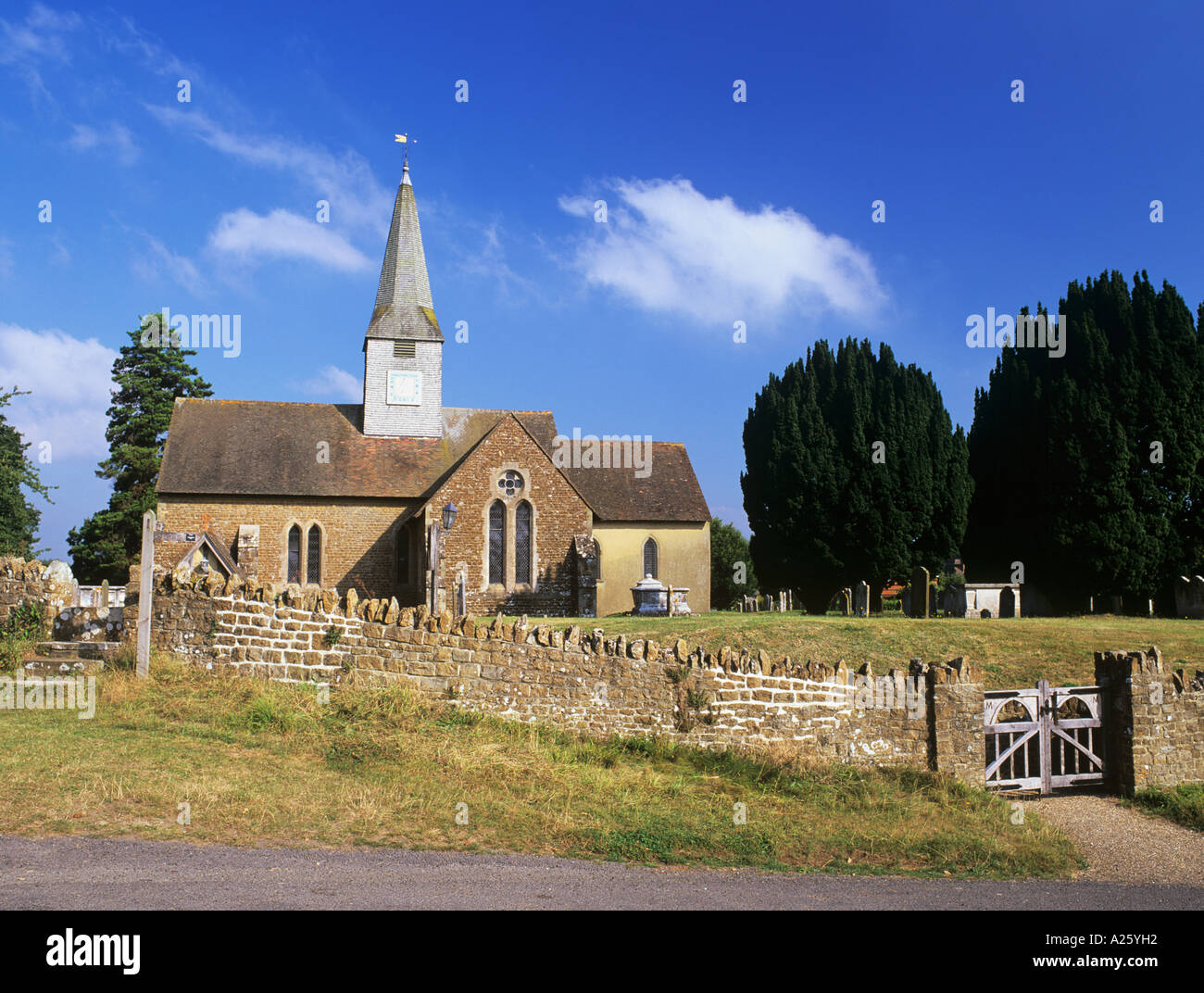 THURSLEY PARISH CHURCH of St Michael of all Angels on the Greensand Way long distance footpath. Thursley Surrey England UK Stock Photo