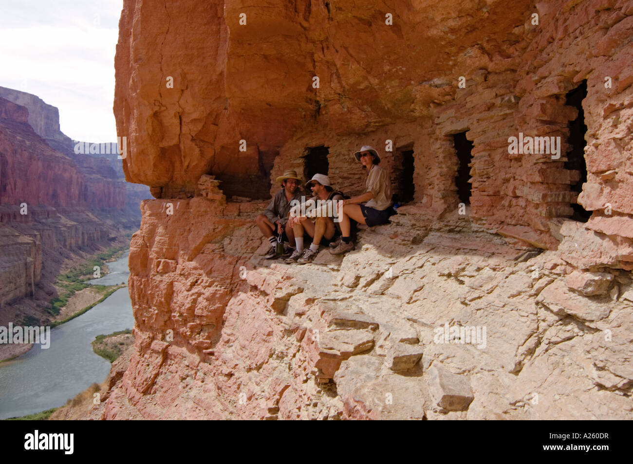 Visitors below the ANASAZI GRANARY near NANKOWEAP CAMP at mile 53 along