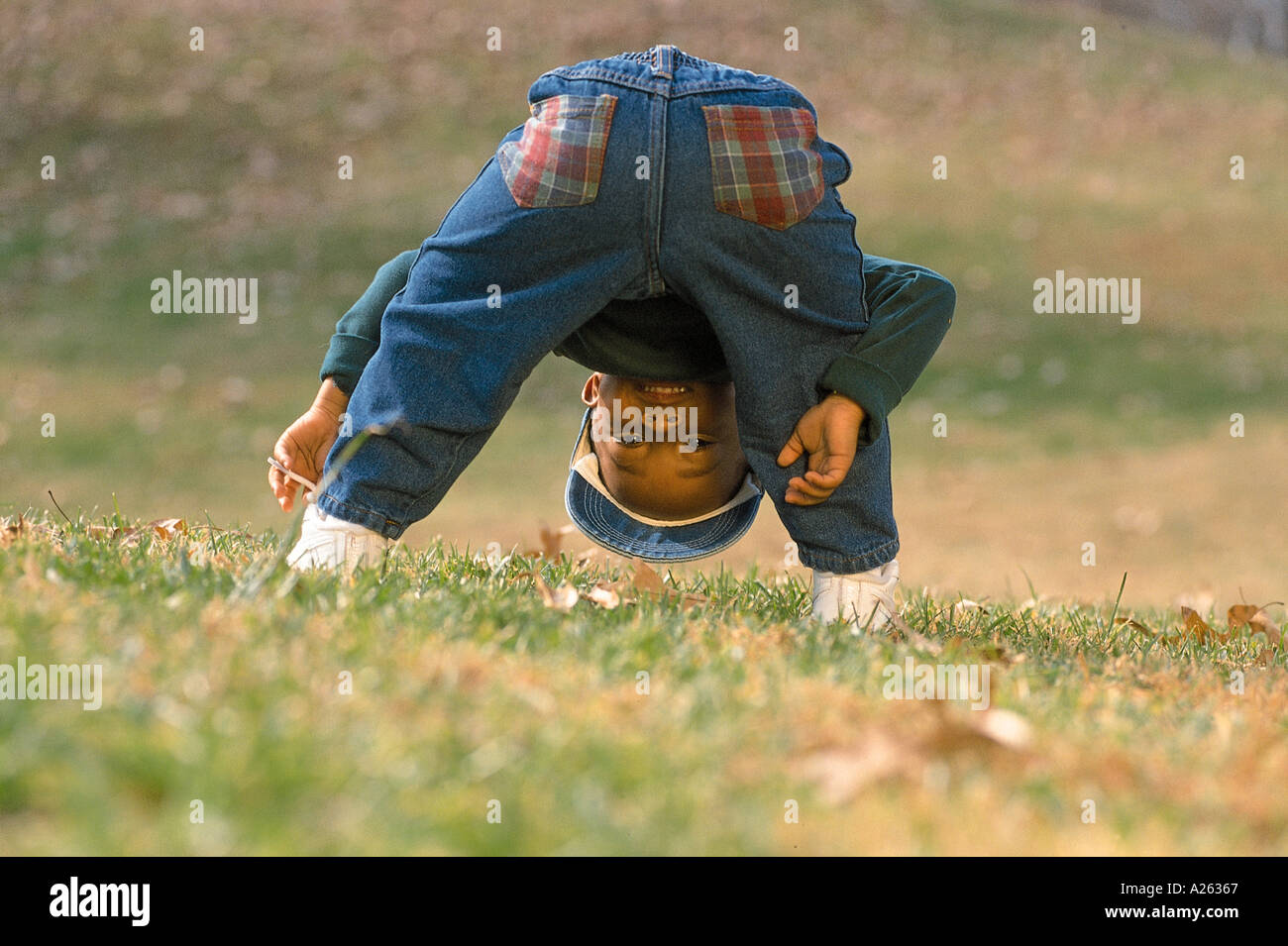 Boy bending over back hires stock photography and images Alamy