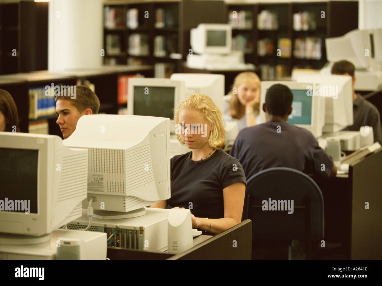 STUDENTS WORKING ON COMPUTERS IN LIBRARY Stock Photo - Alamy