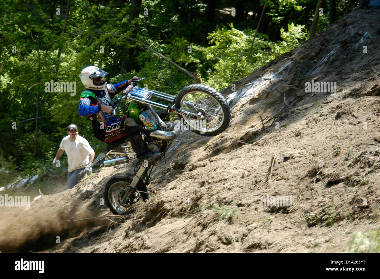 Contestants of all ages compete in a motorcycle hill climb race Stock