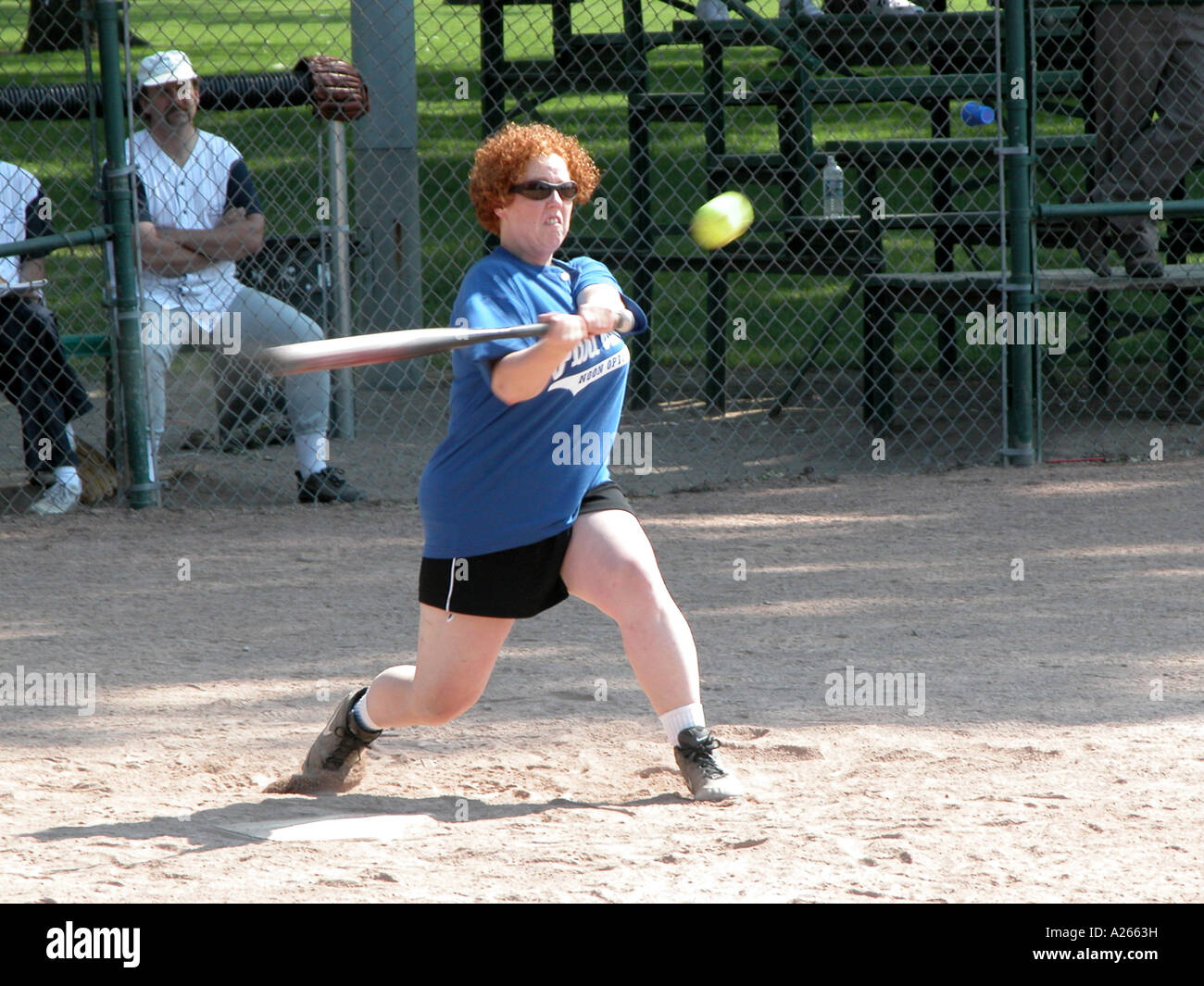 Female hits a softball Stock Photo Alamy