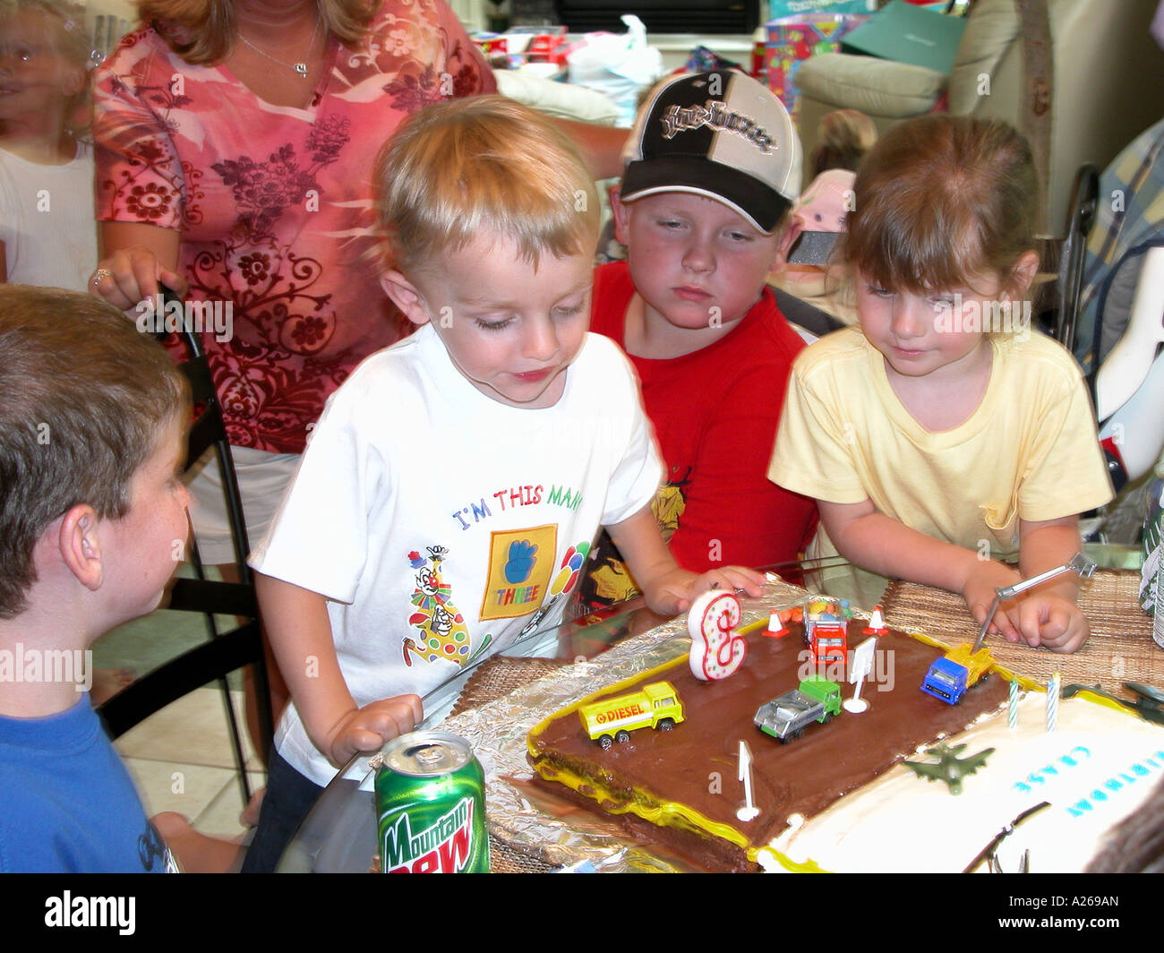 3 Year Old Boy Celebrates Third Birthday By Having A Party Stock Photo Alamy