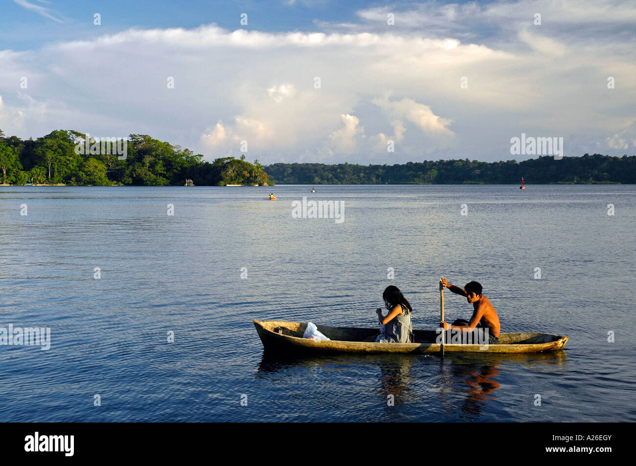 Guaymi husband and wife in traditional boat, Bastimentos Island, Bocas del Toro Archipelago, Panama, Central America Stock Photo