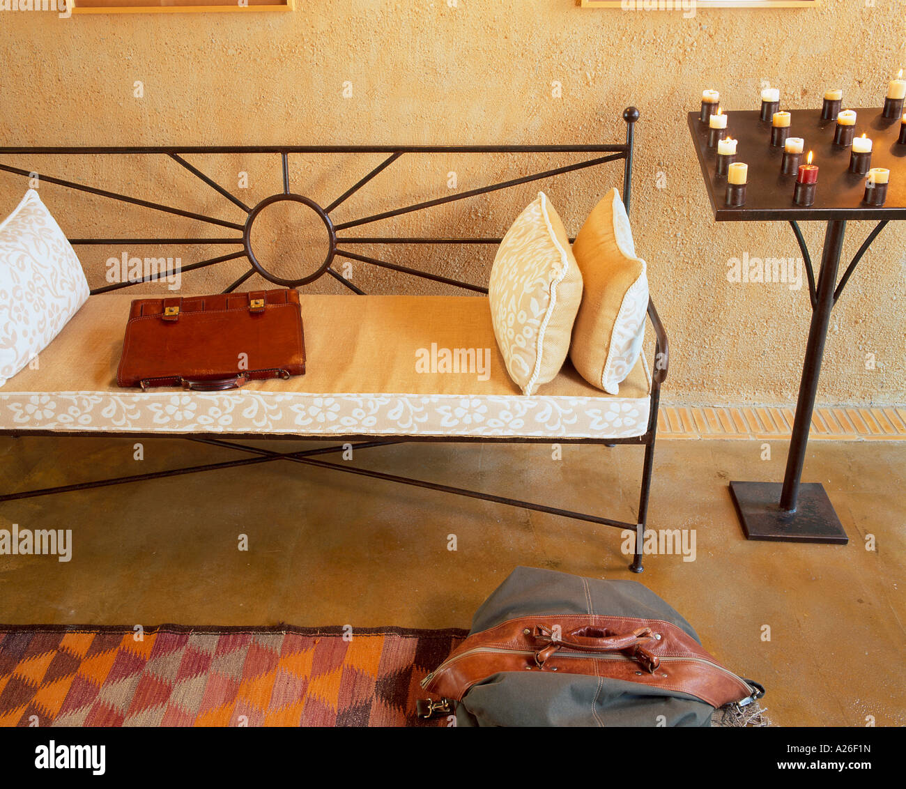 View of candles burning next to a couch Stock Photo Alamy