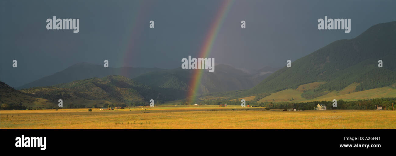 Rainstorm with double rainbow Paradise Valley Absaroka Range Rocky Mountains Montana USA Stock Photo