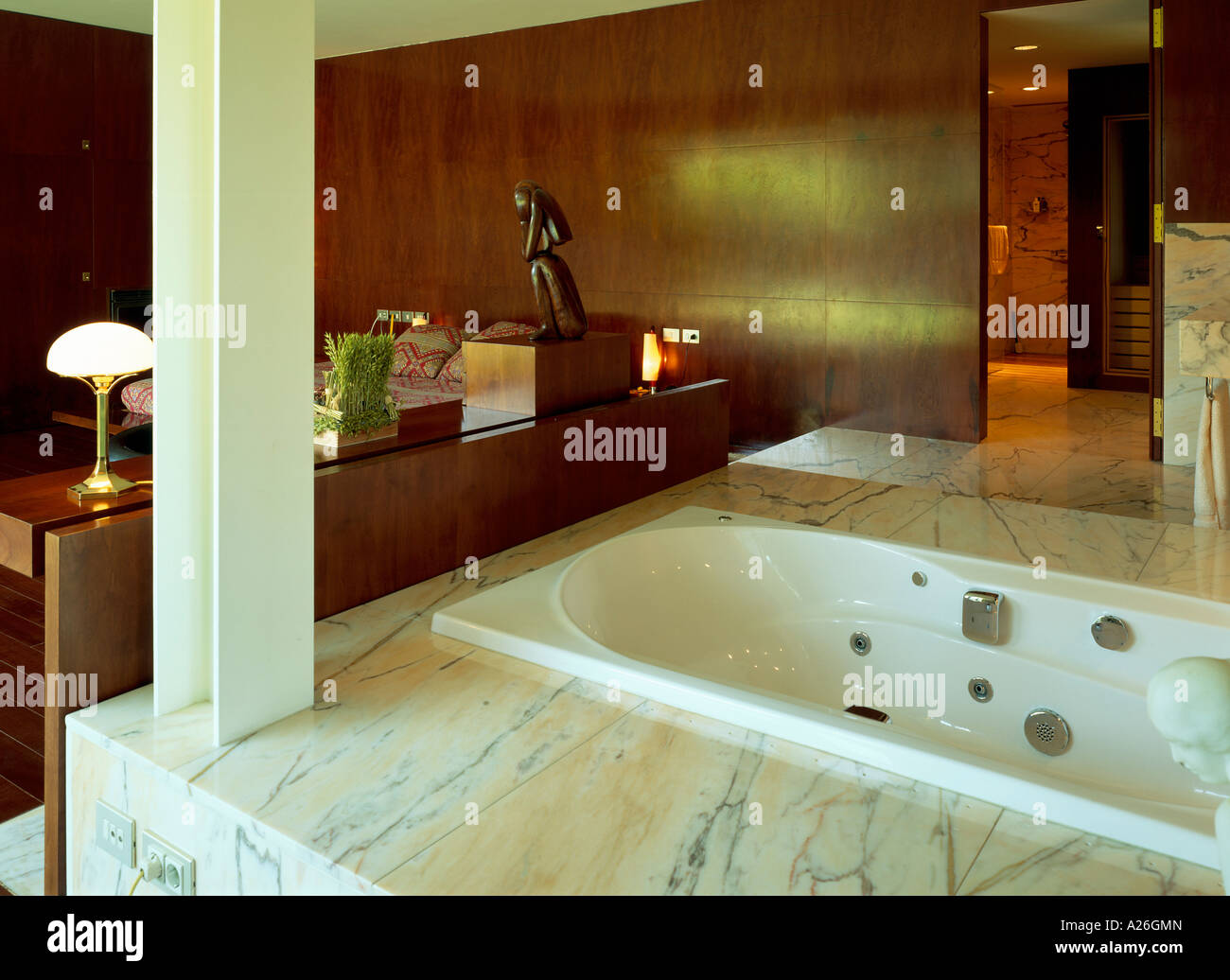 View of a bathroom attached to a bedroom Stock Photo Alamy