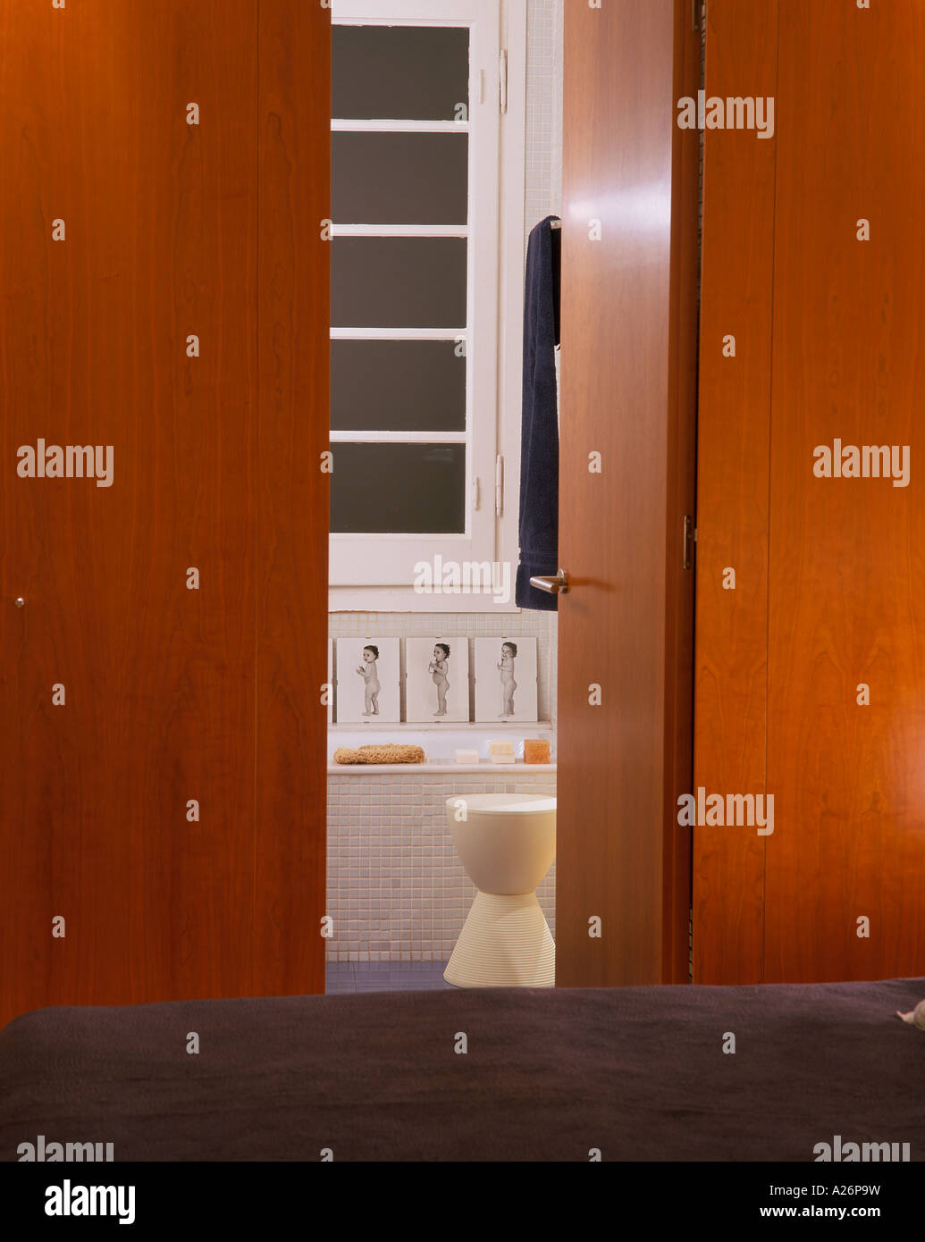 View of a bathroom with an open door Stock Photo - Alamy