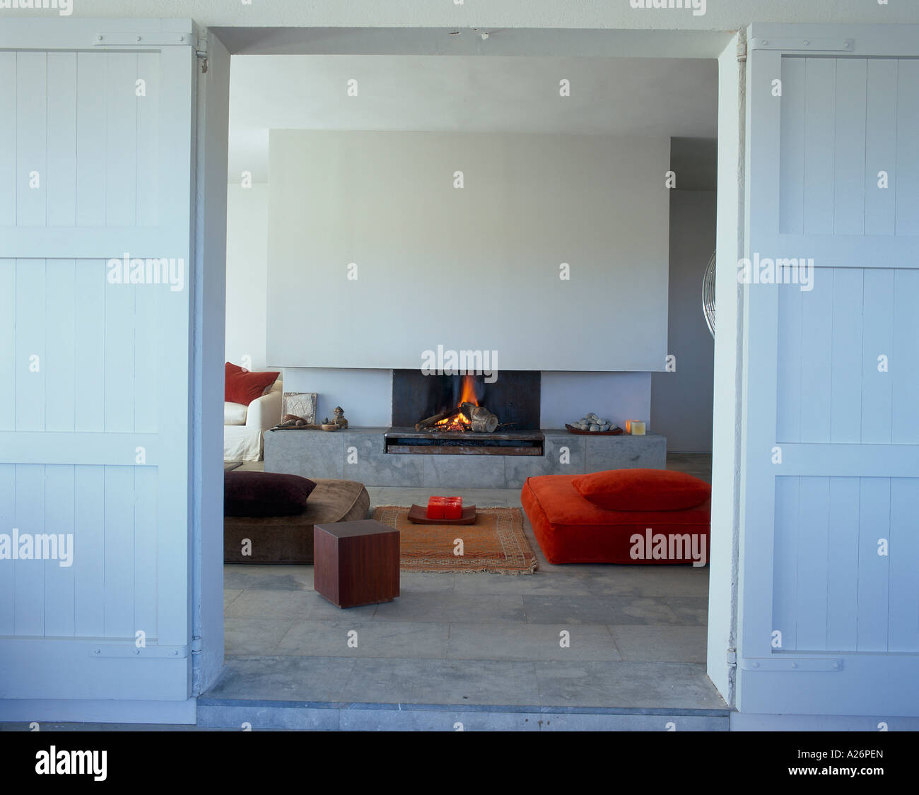 View of a lighted fireplace in a living room Stock Photo - Alamy