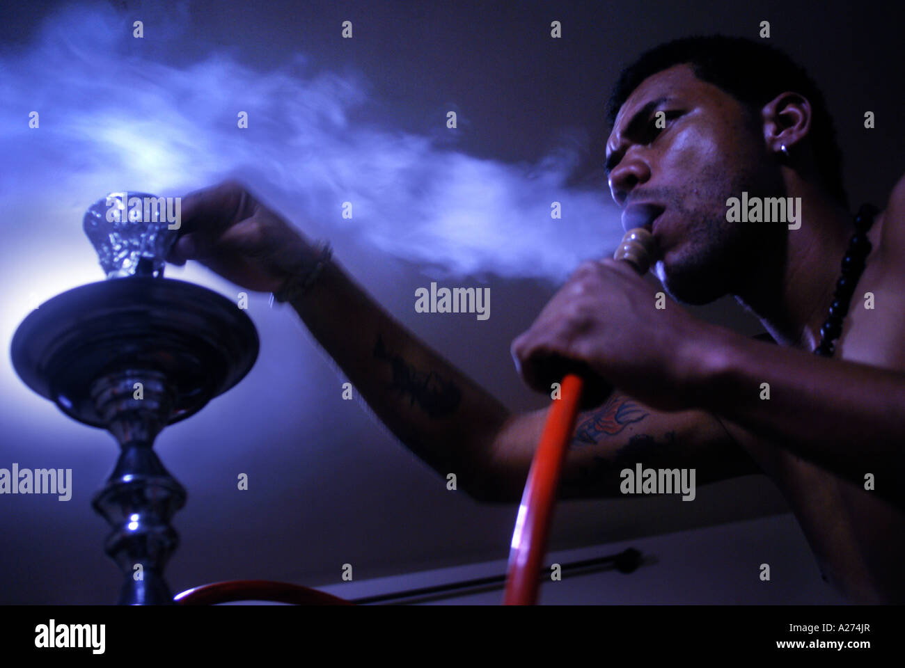 Black man smoking a hookah, Rio de Janeiro, Brazil Stock Photo Alamy
