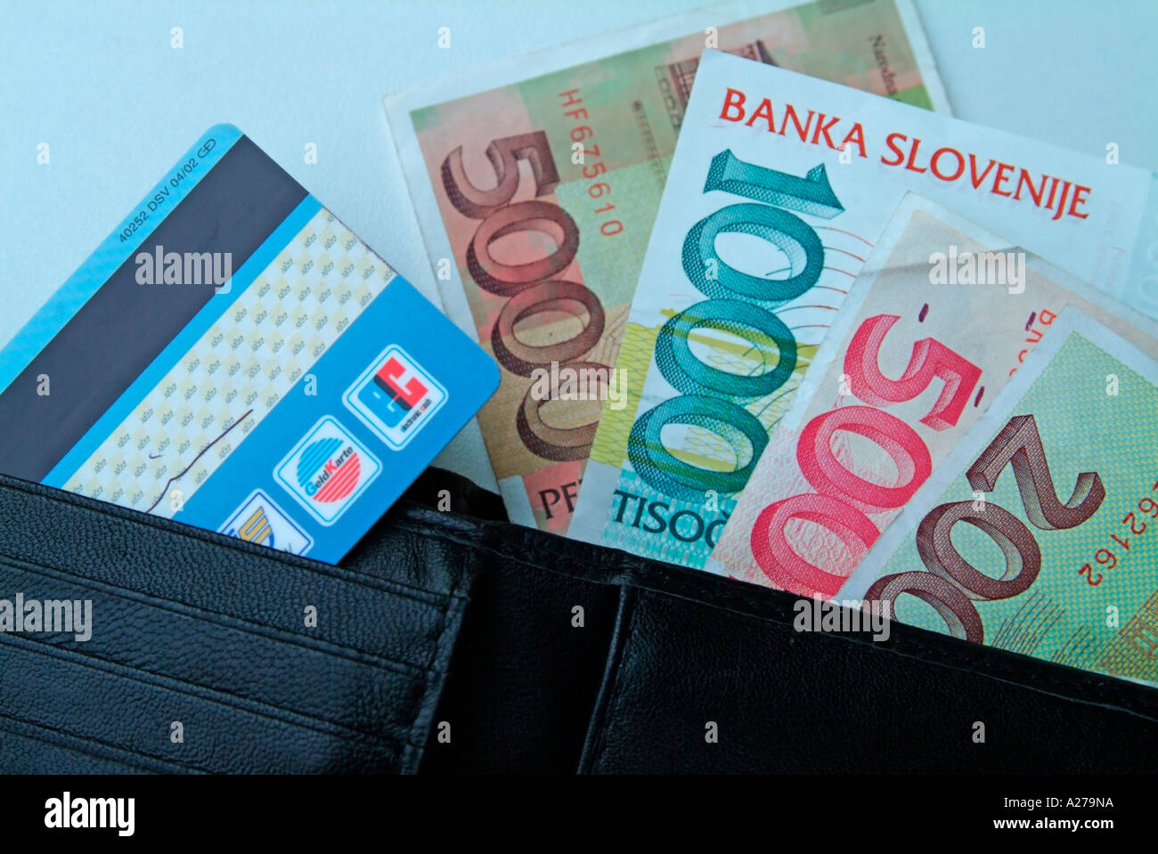 EC card bank card and banknotes bank notes slovenian Tollars in a wallet purse Stock Photo