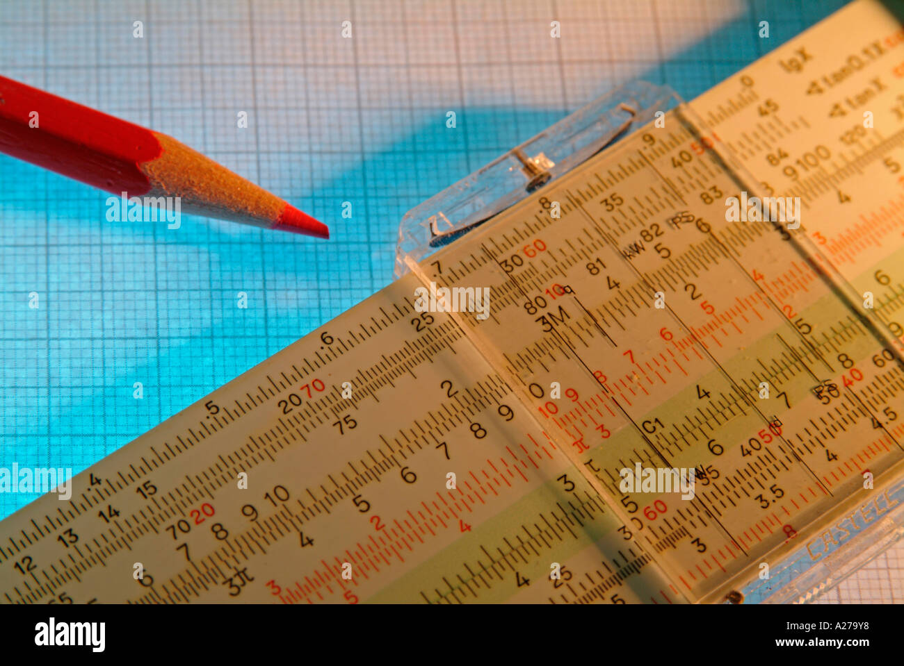 slide rule slidiing rule red pencil on graph paper scale paper Stock