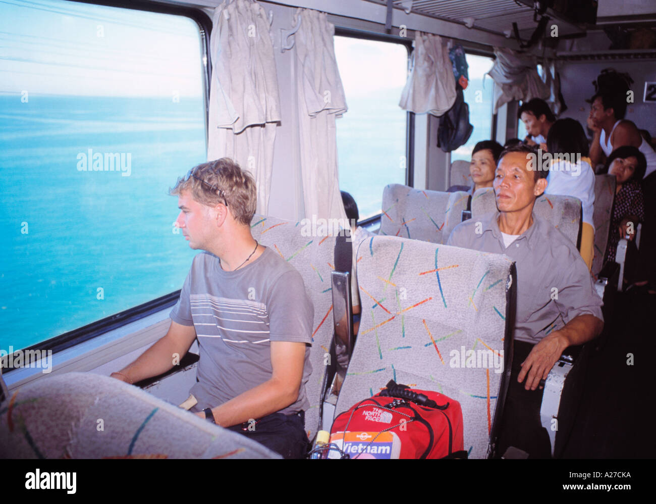 VIETNAM REUNIFICATION EXPRESS TRAVELLER LOOKING AT VIEW Stock Photo