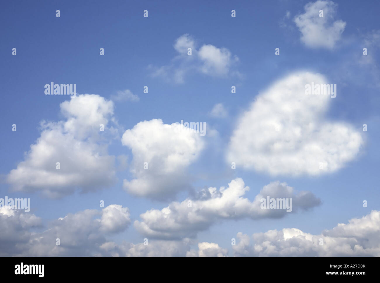 Blue clouded sky with a cloud looking like a heart Stock Photo - Alamy