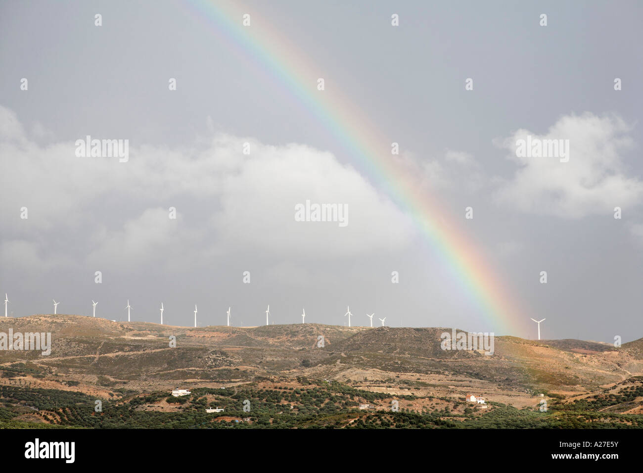 Rainbow above wind power plant near Palekastro, Eastern Crete, Greece Stock Photo