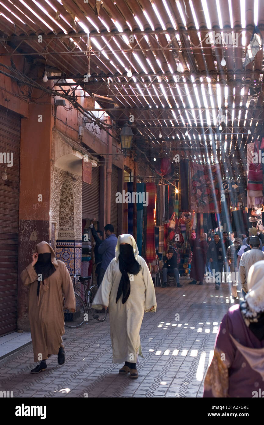 women wearing burkas in the souk near djemaa al fna marakesh morocco Stock Photo