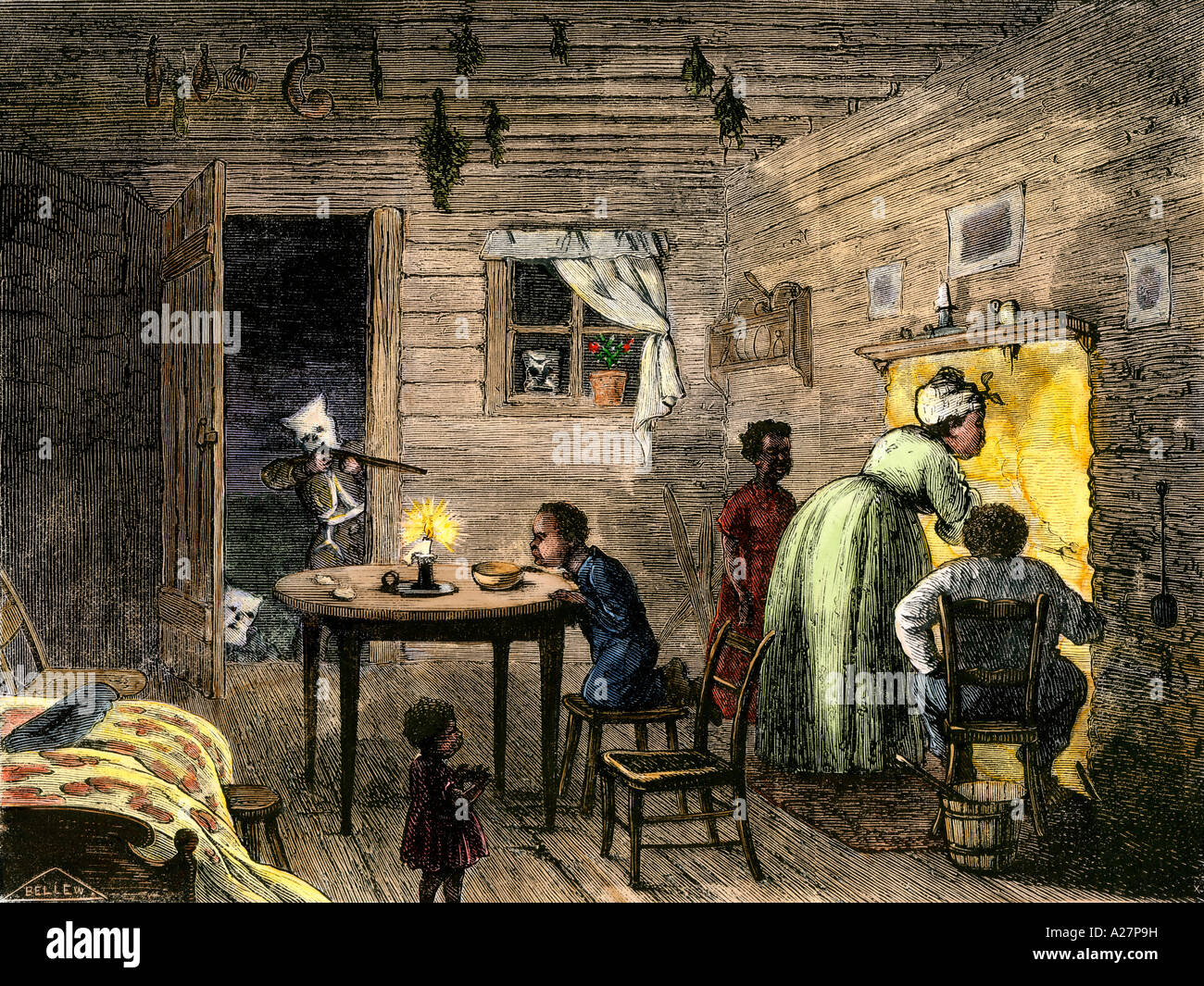 Ku Klux Klan members shooting an African-American family in their cabin in the South 1870s. Hand-colored woodcut Stock Photo