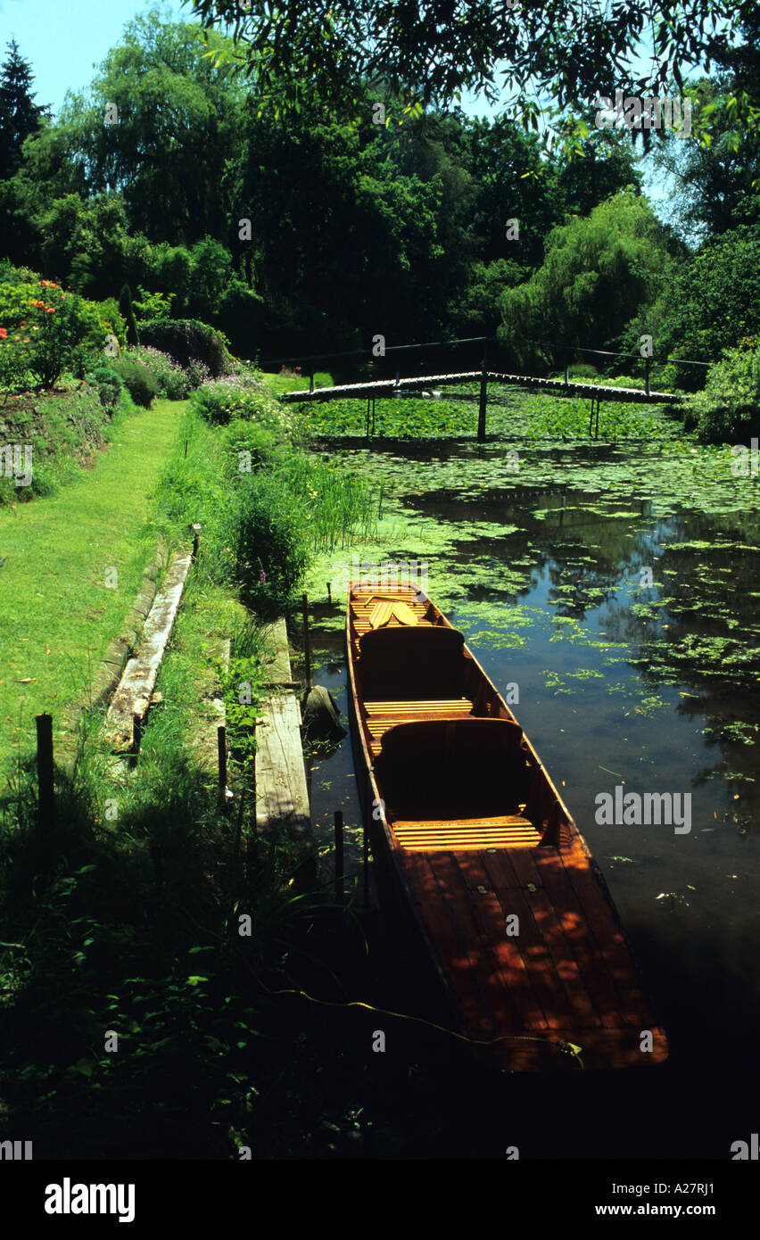 moored boat by private gardens at Shalford Surrey England UK Stock