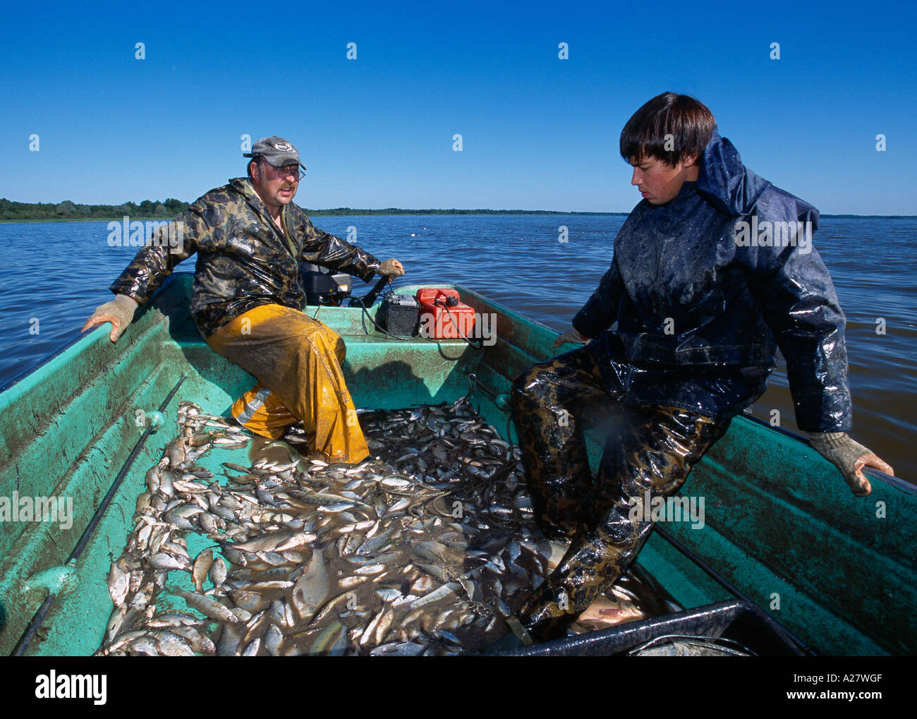 FRESHWATER FISHERMEN WORKING LAKE VORTSJARV Stock Photo