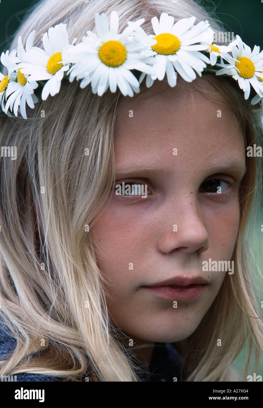 YOUNG ESTONIAN GIRL WEARING FLOWER CROWN AT JAANIPAEV Stock Photo