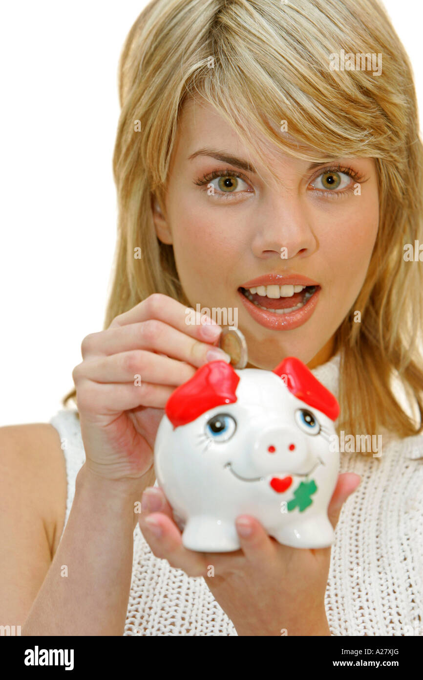 Frau mit Sparschwein, woman with piggy bank save here money Stock Photo