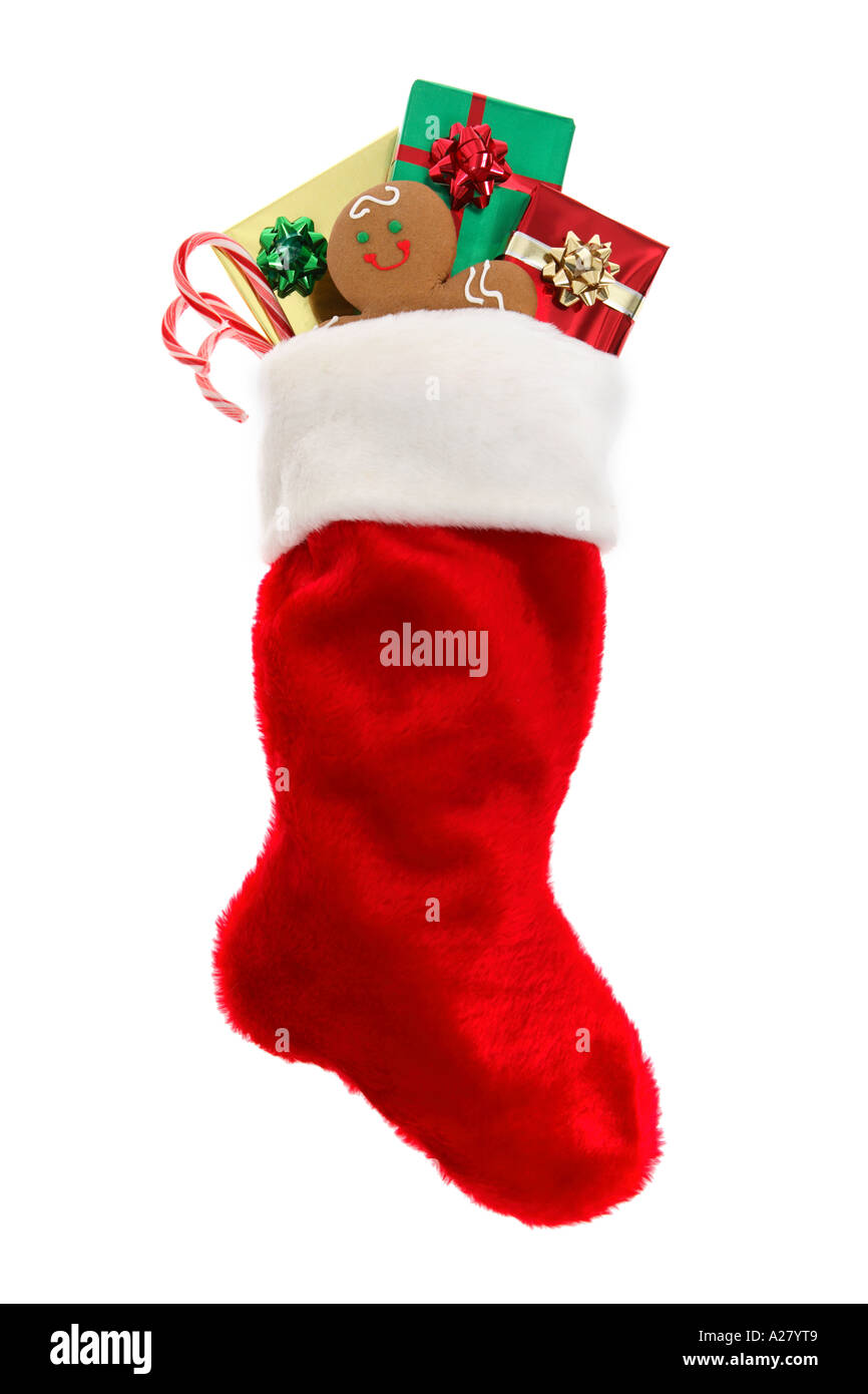 Christmas Stocking Stuffed With Gifts Gingerbread Cookie And Candy Canes Stock Photo Alamy