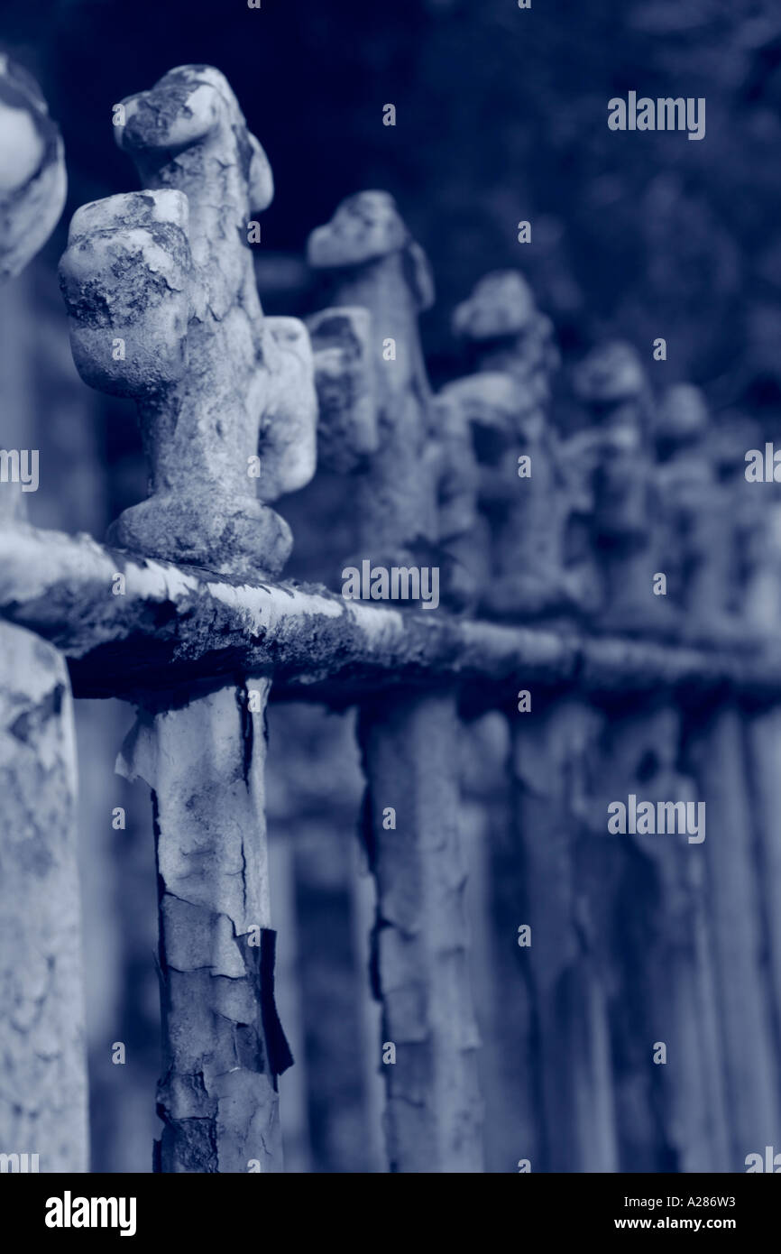Decorative tops of old fence railings Blue Tone Stock Photo
