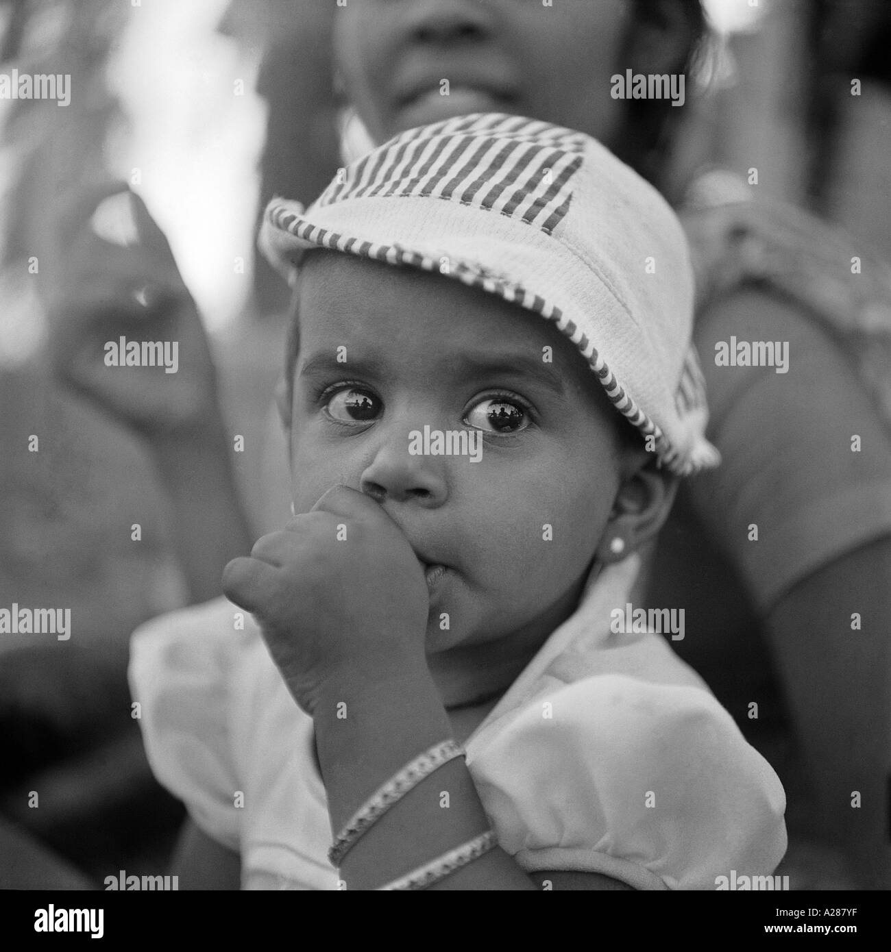 baby girl sucking thumb Stock Photo