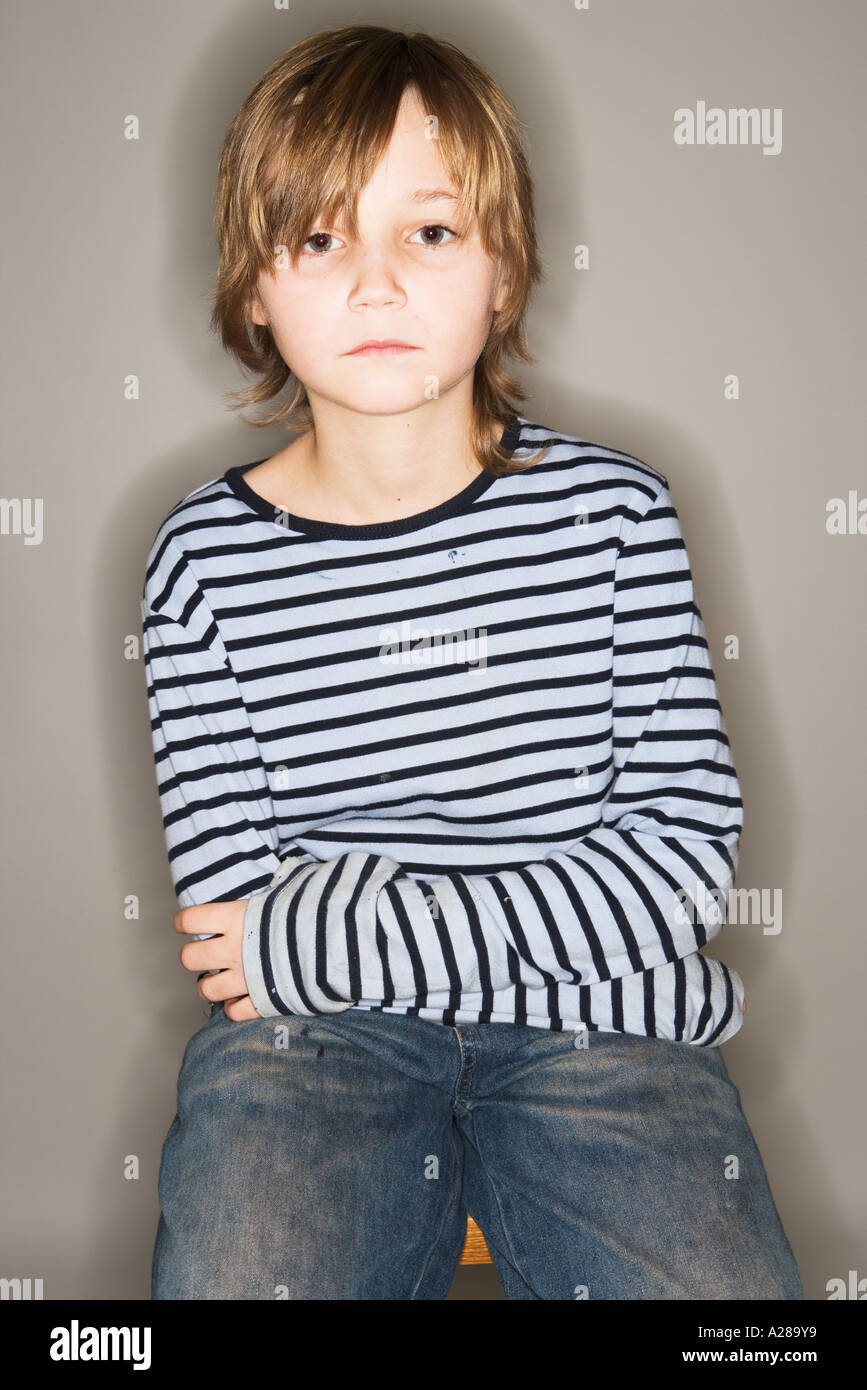PORTRAIT OF 11 YEAR OLD BOY SITTING ON STOOL Stock Photo Alamy