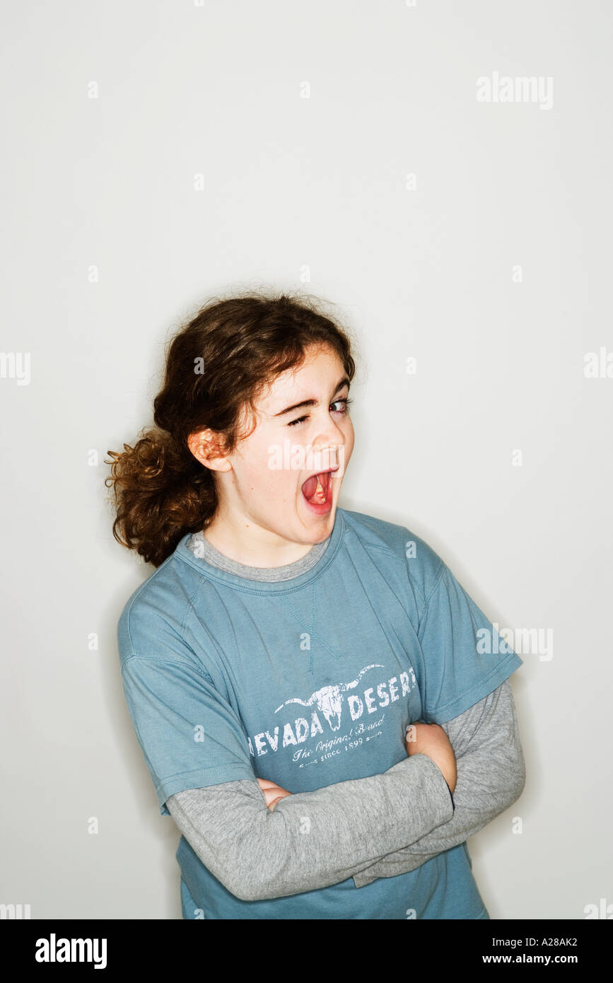 PORTRAIT OF 11 YEAR OLD BOY PULLING FACE Stock Photo