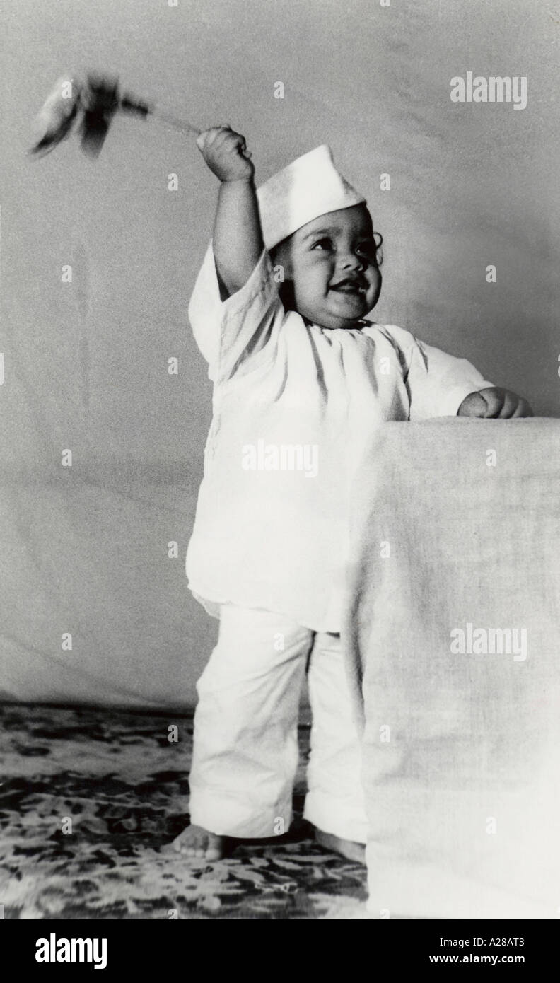 Dressed up in khaddar kurta and Gandhi cap a child waves the Indian National Flag on Independence Day 1947 Stock Photo