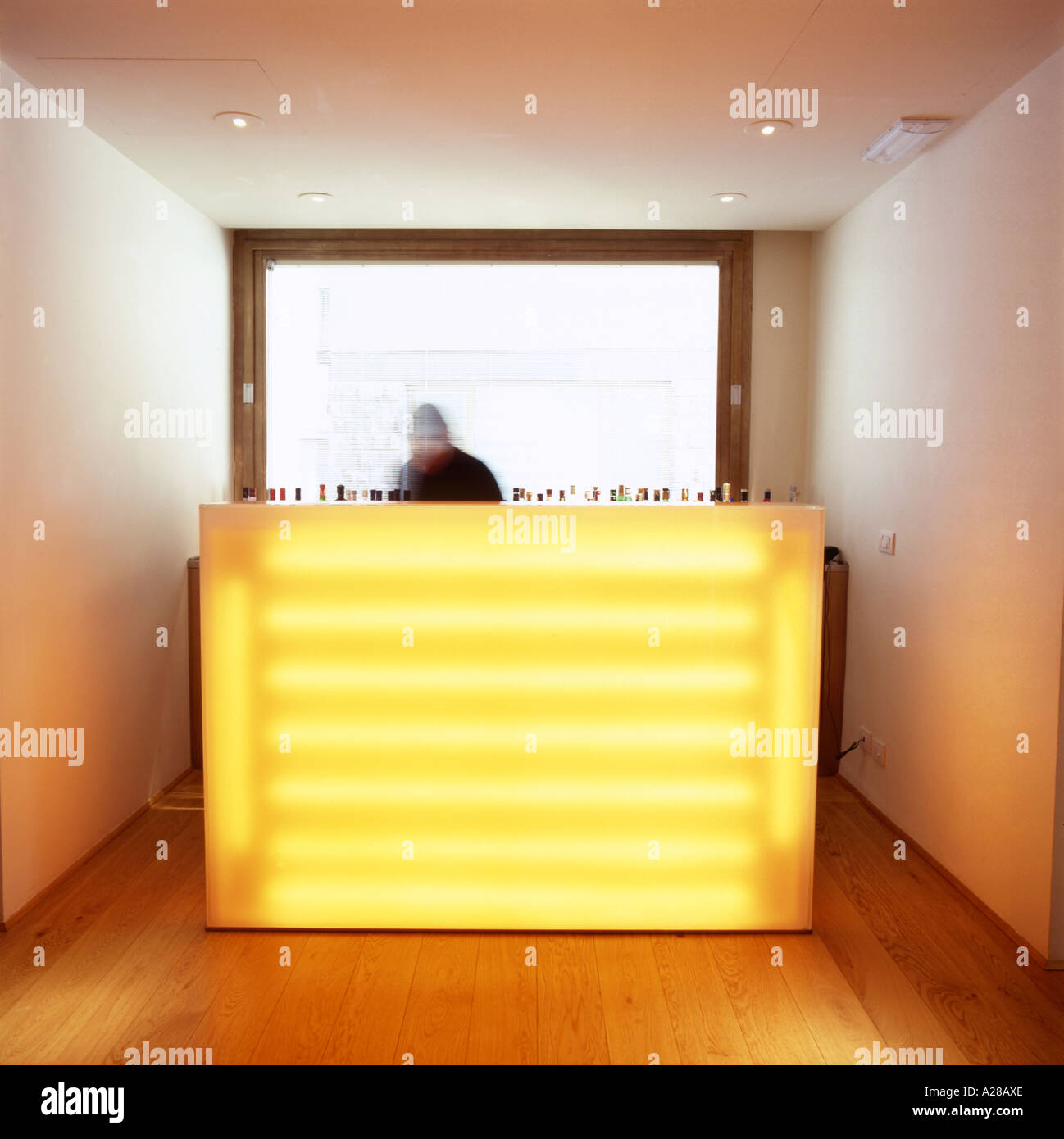 bar tender working in a modern and stylished bar in Italy preparing a