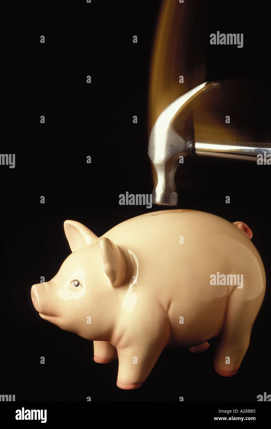 Piggy bank hit by hammer Stock Photo - Alamy