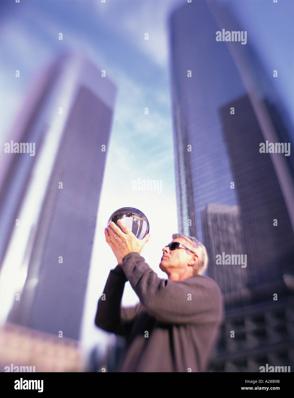 Businessman looking into crystal ball hi-res stock photography and ...