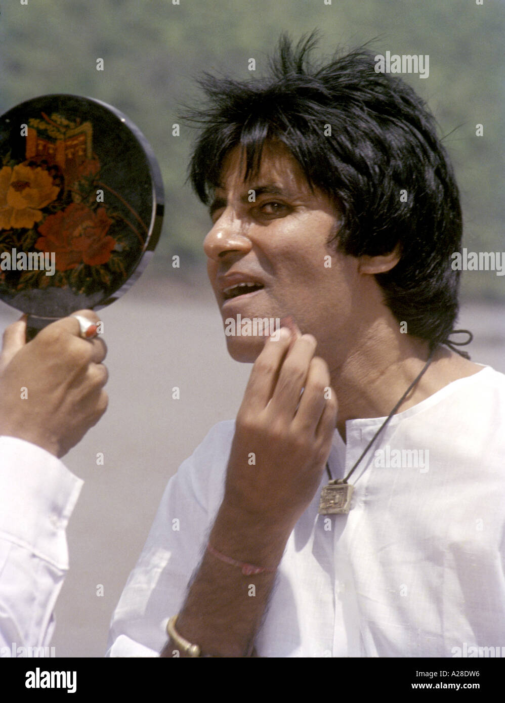Amitabh Bachchan, Indian Bollywood hindi movie film star actor, applying makeup on film set in India Stock Photo