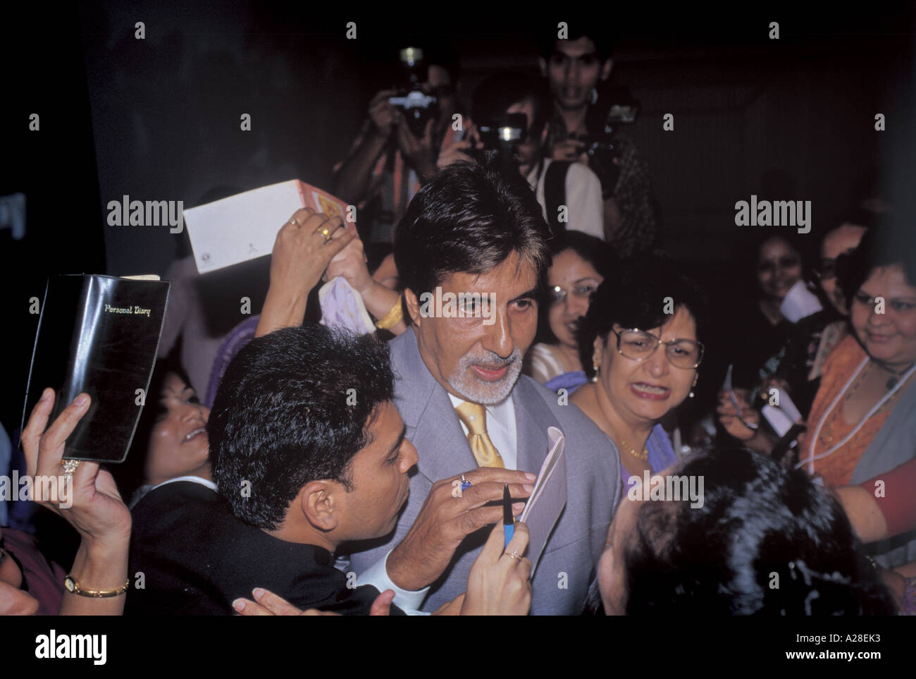 Indian Bollywood Film Star Actor Amitabh Bachchan surrounded by fans Stock Photo