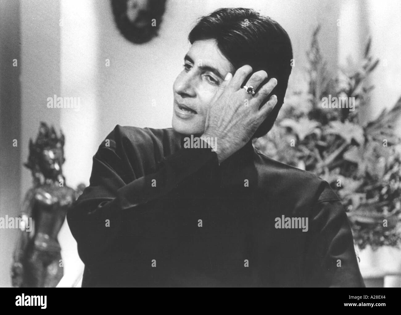 Indian Bollywood Film Star Actor Amitabh Bachchan smiling in a TV interview India Stock Photo