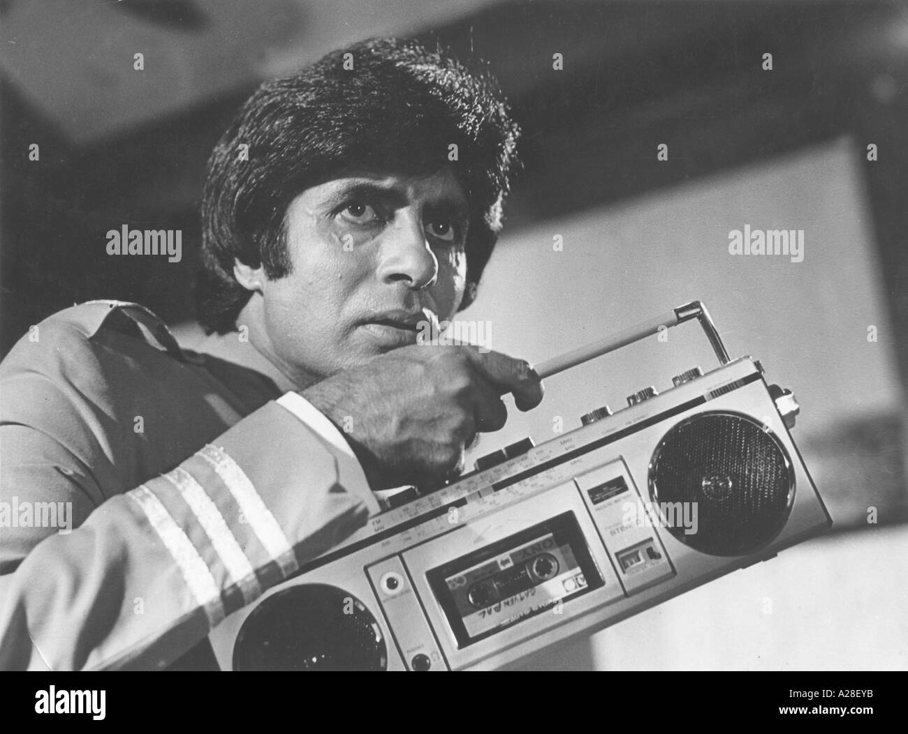 Amitabh Bachchan Indian film actor in the movie Muqaddar Ka Sikander with tape recorder India Asia old vintage 1900s picture Muqaddar Ka Sikandar Stock Photo