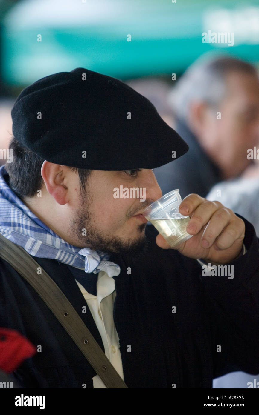 Man in traditional Basque dress wearing a black beret drinking txakoli at the Santo Tomas Saint Thomas celebration Bilbao Spai Stock Photo Alamy