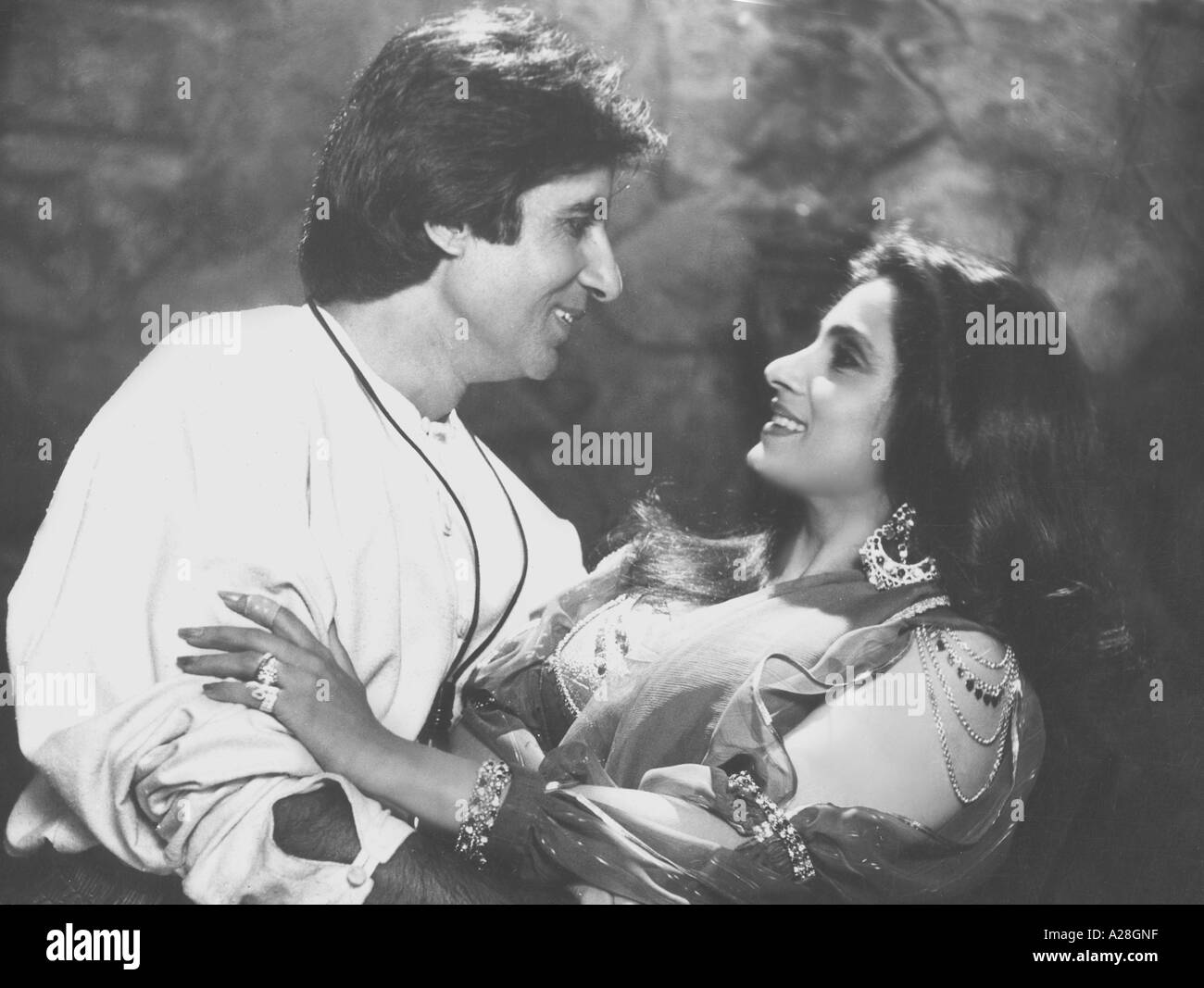 Old vintage 1900s Bollywood Film Star Indian Actor Amitabh Bachchan with actress Dimple Kapadia in Hindi Movie Ajooba India Asia Stock Photo