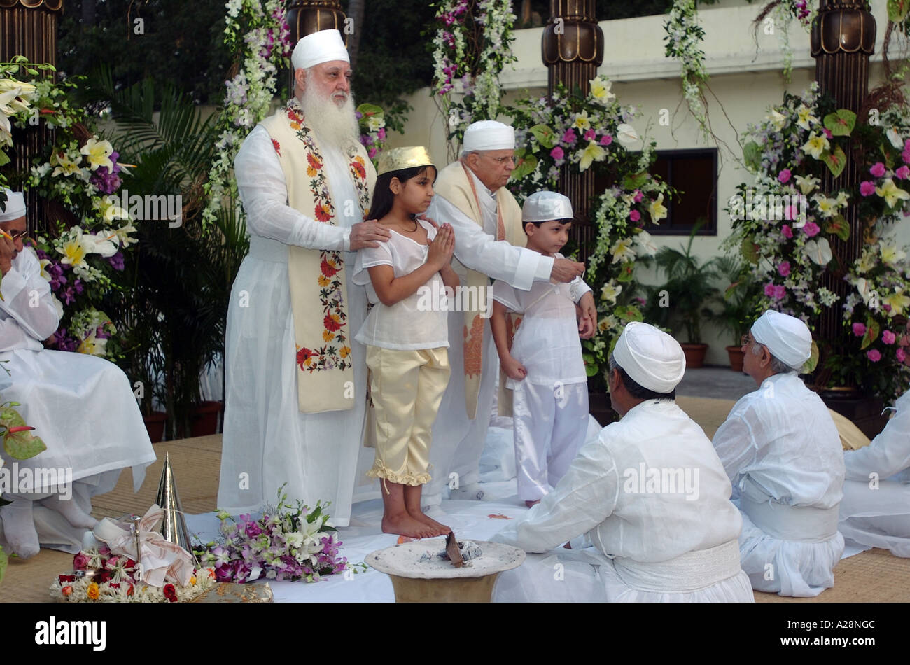 Parsi, Parsee, Zorastrian, Navjote, Navjyot, child religious ceremony, white dress, cap, headgear, Mumbai, Maharashtra, India, Asia, Asian Stock Photo