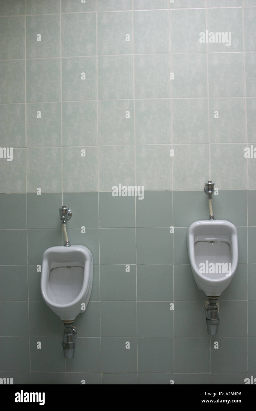 urinals with different height for adult and child Stock Photo Alamy