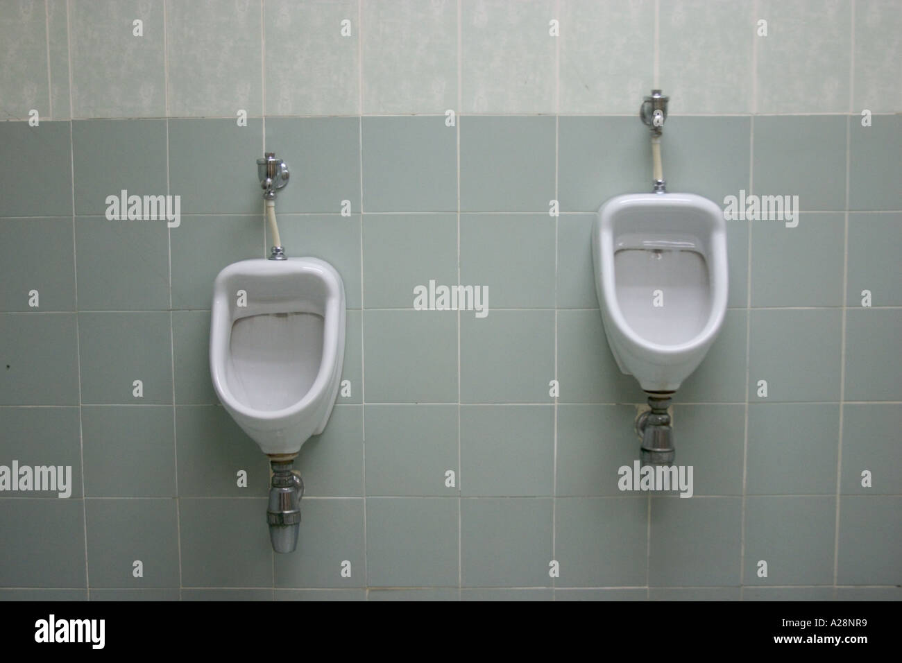 urinals with different height for adult and child Stock Photo Alamy