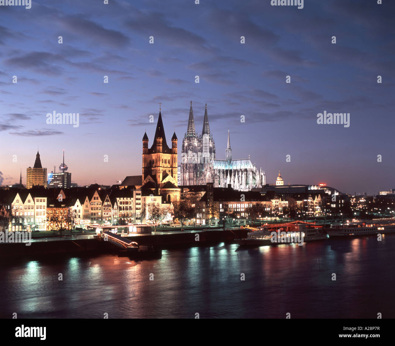 City view at dusk across Rhine River, Cologne (Koln), Nordrhein-Westfalen, Federal Republic of Germany Stock Photo