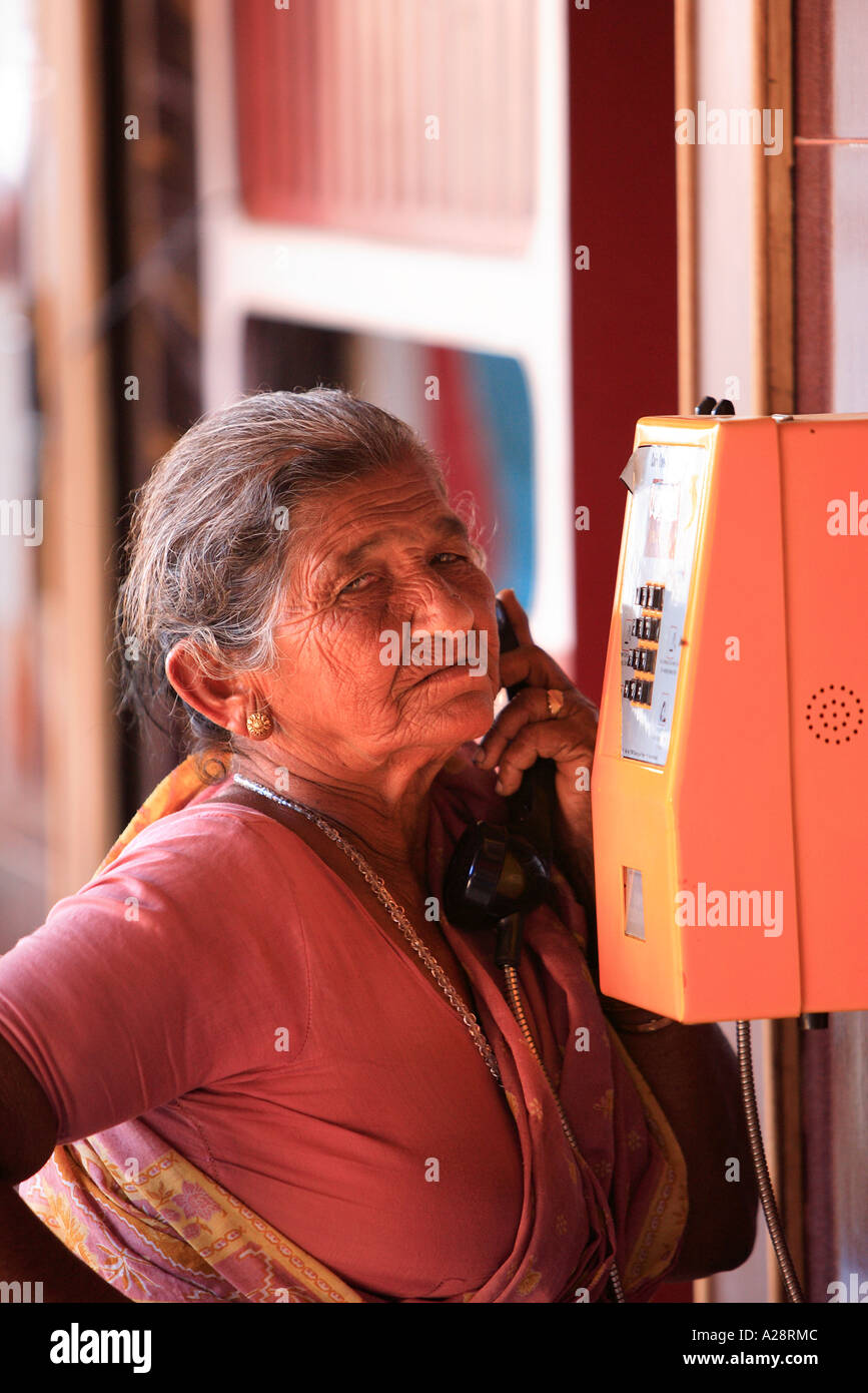 Old Lady On Public Phone Mapusa City Goa India Stock Photo