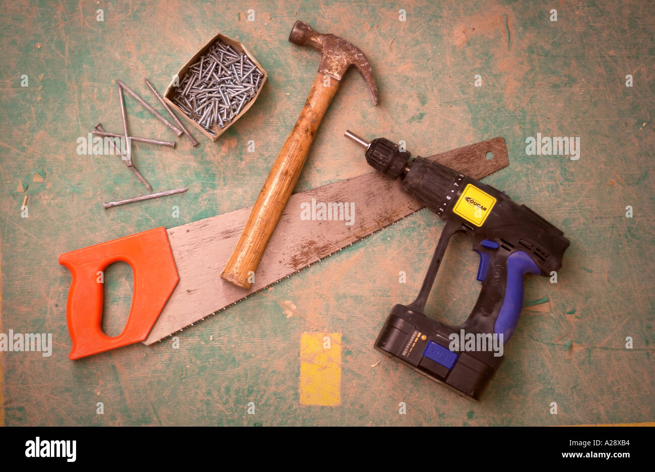SOME BUILDERS TOOLS ON A HARDBOARD FLOOR Stock Photo Alamy